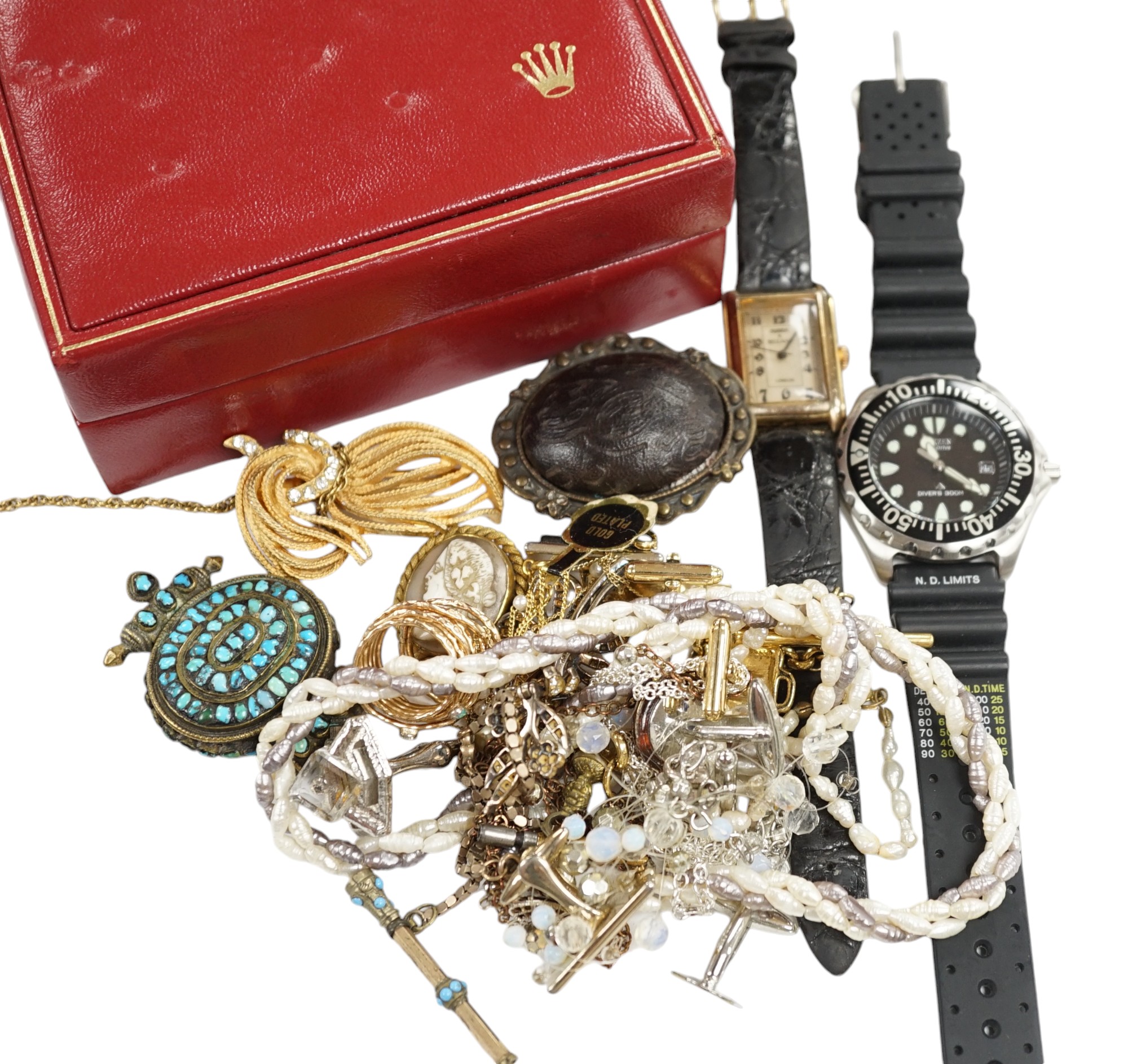 A small group of assorted costume jewellery including cufflinks, rings, brooches etc. together with two wrist watches and a Rolex box. Condition - poor to fair